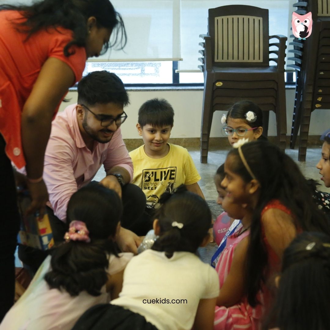 CueKids Educator Teaching Children in Group Activity